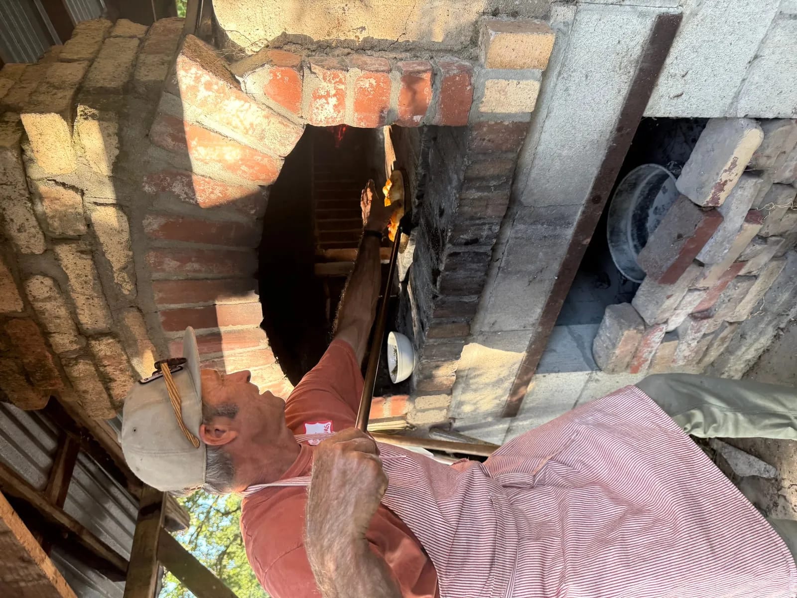 Tending the wood-fired oven