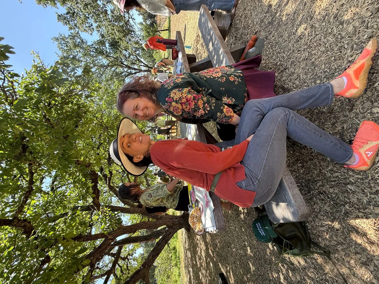 Two attendees laughing outdoors