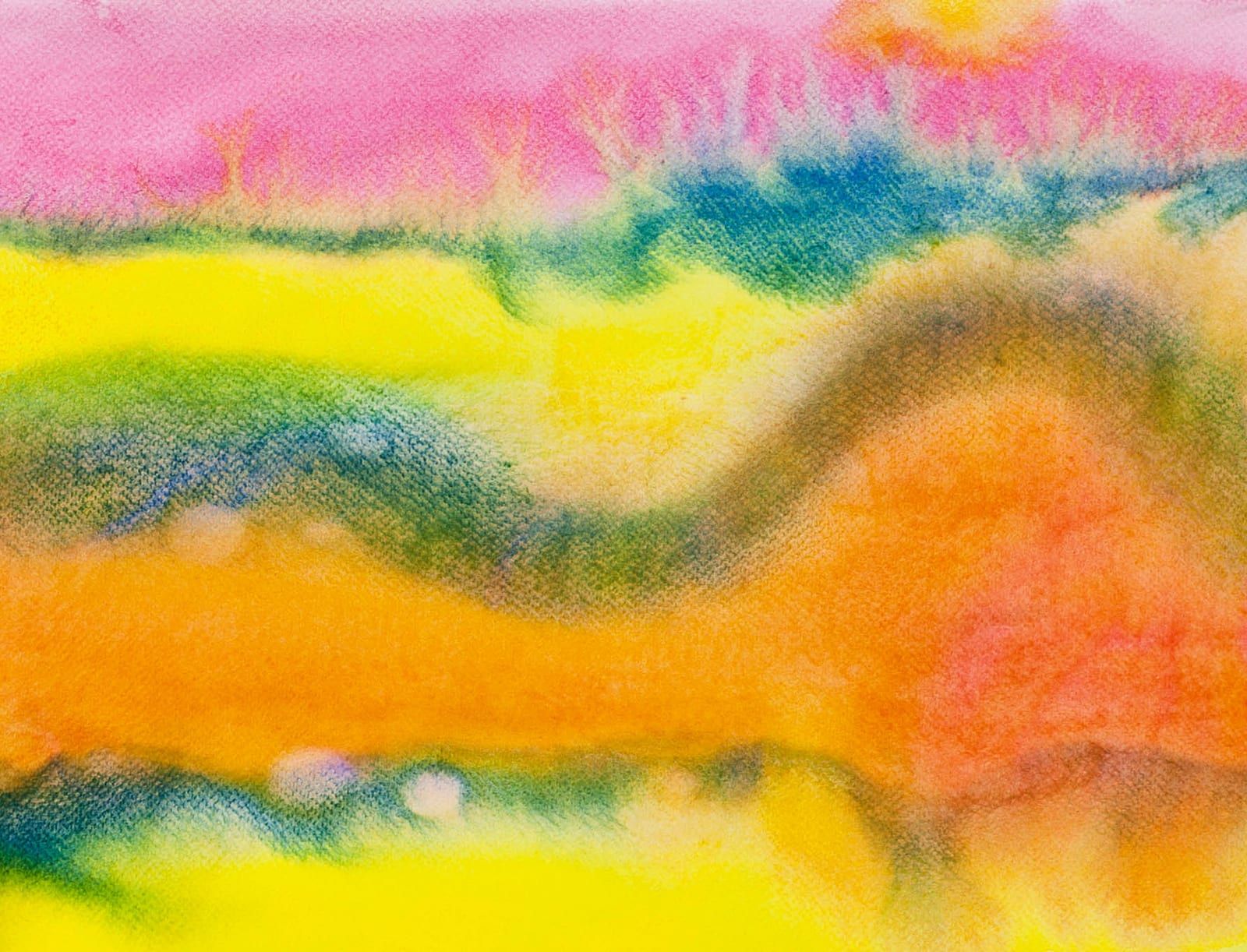 A close-up of a vibrant watercolor wash in orange, pink, teal, and green, with soft overlapping color bands suggesting a sunset over rolling hills.