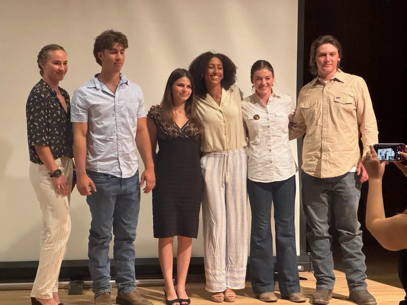 Seniors on stage after presenting their senior projects.