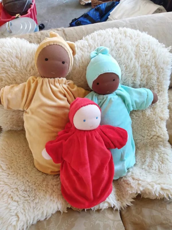 dolls in basket