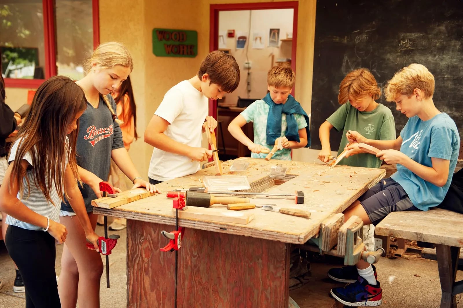 Woodwork class at the outdoor bench.
